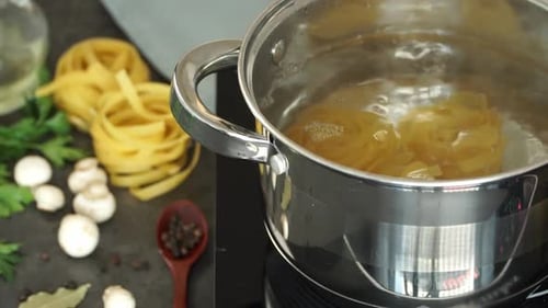 Cooking fresh tagliatelle pasta in boiling water