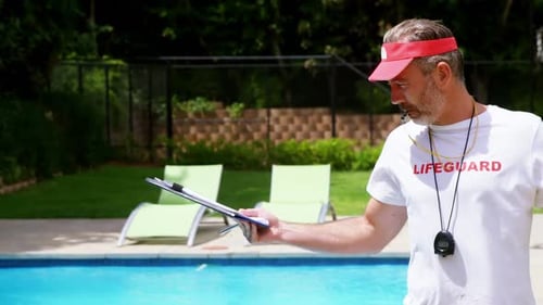 Lifeguard Stands by Pool on Sunny Day