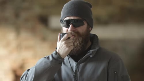 Man Uses Portable Radio Inside Building