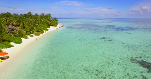 Aerial drone view of a scenic tropical island in the Maldives.