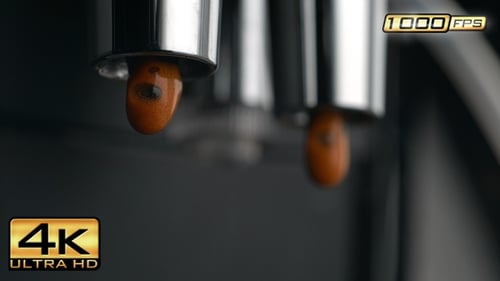 Close-up of Espresso Pouring from Coffee Machine Spout