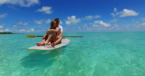 Beautiful lady and man in love dating on vacation spend quality time on beach on paradise white sand