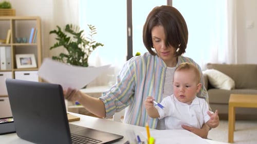 Working Mother with Baby Boy at Home Office