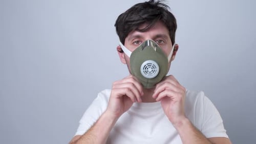 Man Putting on Mask for Protection