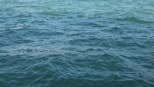 View motion dark blue waves on water