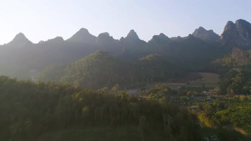 Aerial top view of forest trees and green mountain hills. Nature landscape background, Thailand.