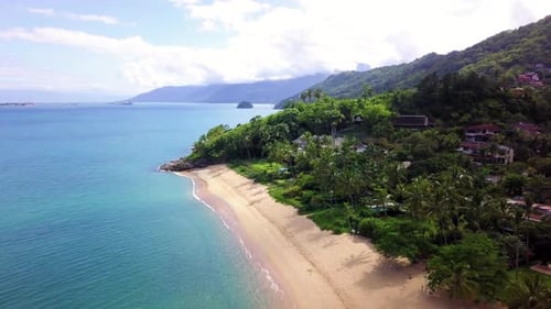 Aerial capture of a beautiful beach with crystal clear waters on the Brazilian coast.