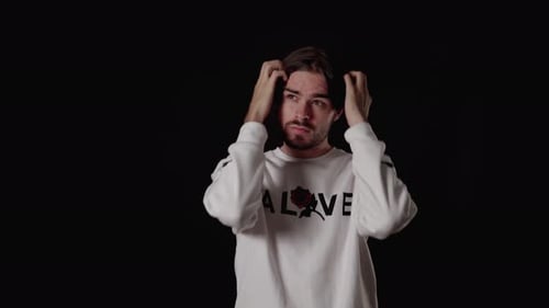 Man Looking Anxious and Confused in Studio