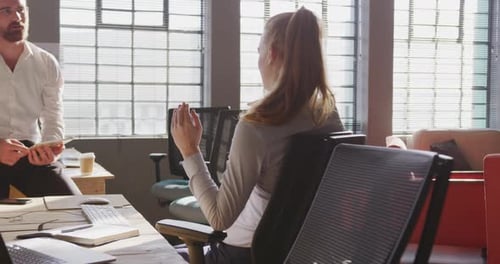 Young creative professionals working in a modern office