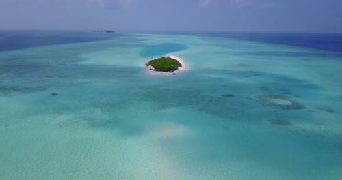 Natural overhead island view of a white paradise beach and blue sea background
