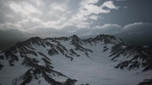 Aerial Flight Over Dramatic Snowy Mountain Peaks