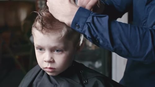 Child Getting a Haircut at Home