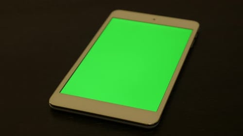 Modern silver PC tablet with green screen display 4K 2160p UltraHD footage - Silver tablet computer
