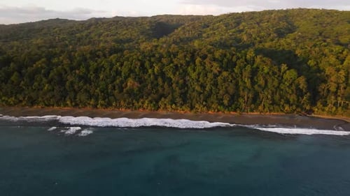 Slow aerial shot flying away from the coast of Osa Peninsula, Costa Rica