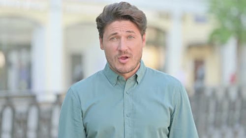 Man Celebrates Good News, Smiling with Joy