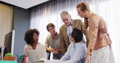 Team Collaborates in Modern Office Space