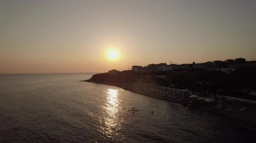 Aerial Scene of Resort and Sea at Sunset. Trikorfo Beach, Greece