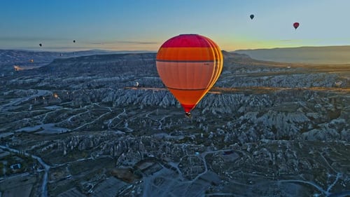 Hotair Balloons Flying Over the Mountain Landsape of CappadociaTurkey