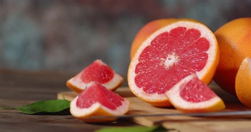 Close Up of Cut Grapefruit on Wooden Board