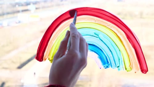 Hand Painting a Colorful Rainbow on Window