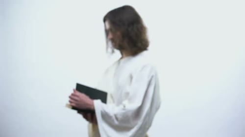 Man in Robe Reading Sacred Book