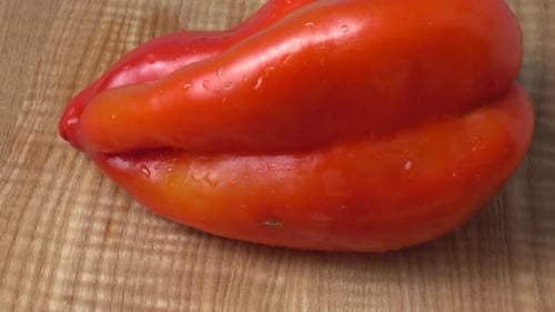 Red Bell Pepper on Wooden Cutting Board