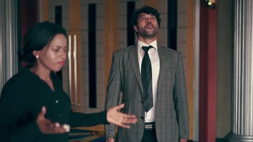 Woman Arguing with a Man in a Suit