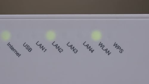 Wi-Fi Router Blinking Lights Indicating Connectivity