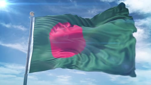 Waving Flag of Bangladesh Against Blue Sky