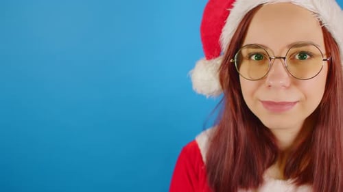 Smiling Woman in Santa Hat Close Up