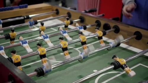 Handsome Cheerful Men Having Fun on Event Playing Table Soccer Close Up Sport Competition Contest