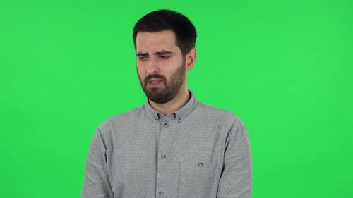 Portrait of Brunette Guy Is Very Offended and Looking Away