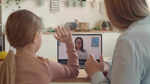 Child and Adult Video Calling with Laptop Computer