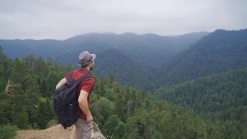 Man with Backpack Enjoying Forest Viewpoint