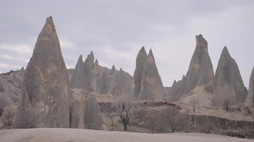 Aerial View of the Amazing Rock Formations in the Deep Valleys of Cappadocia Turkey