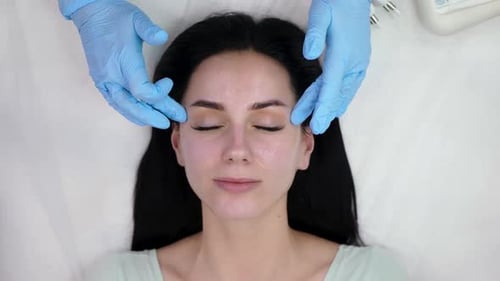 Woman Receiving Facial Treatment at Medical Spa