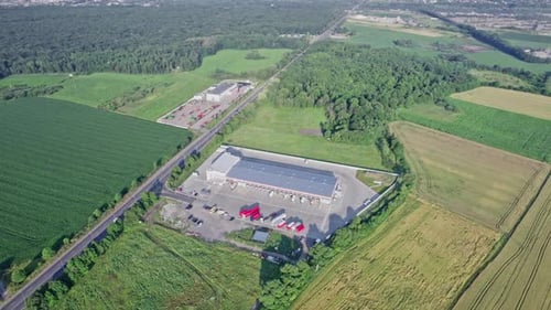 Trucks in the Parking Lot Near Warehouse