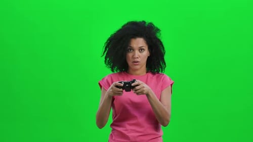Woman Focused Playing Video Game Using Controller