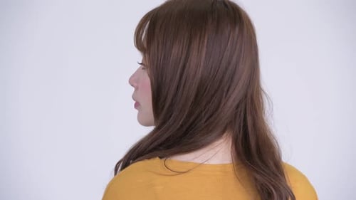 Closeup Rear View of Young Beautiful Asian Woman Looking Back