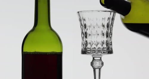 Rose Wine. Red Wine Pour in Wine Glass Over White Background