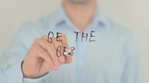 Hand Writes 'Be The Best' with Marker