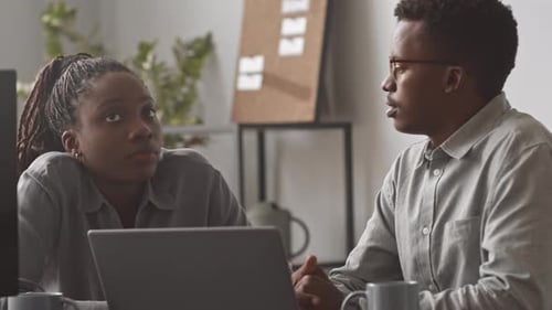 IT Programmers Chatting at Workplace