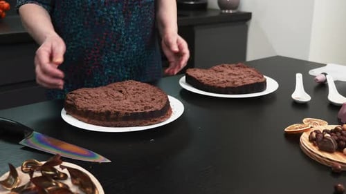 Woman Preparing Chocolate Cake at Kitchen Table
