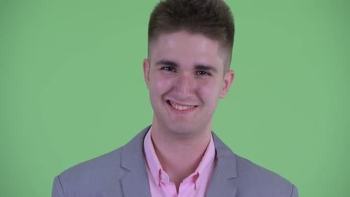 Smiling Young Adult in Gray Suit Jacket