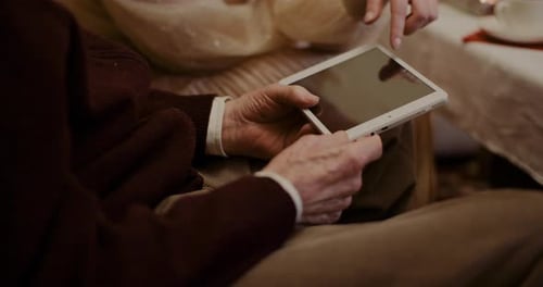 Older Adult Using Tablet Device Close Up