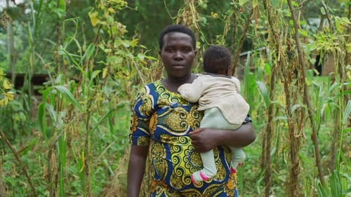 African woman holding a baby
