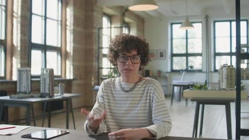 Female Architect Talking on Camera in Office