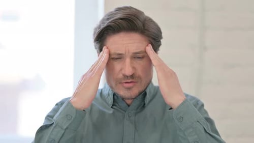 Middle Aged Man having Headache
