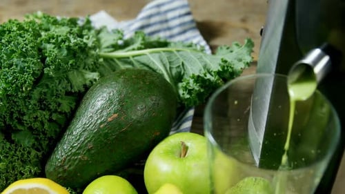 Healthy Green Juice Being Made at Home