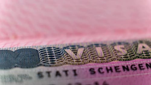 Schengen Visa in Passport Close Up